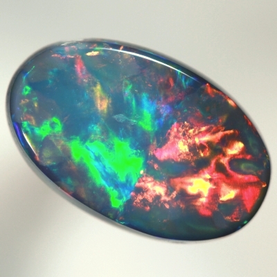 SOLID BLACK OPAL Top quality. Rolling flashes of cherry red and magenta, bright green and purple. SEE VIDEO